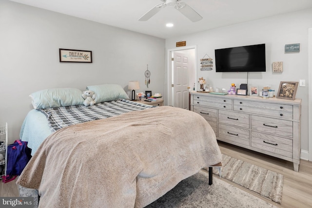 bedroom featuring light wood-type flooring and ceiling fan