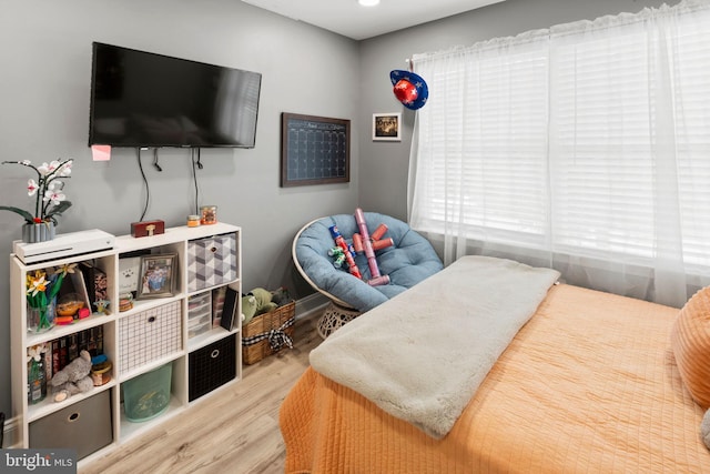 bedroom with wood-type flooring