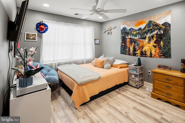 bedroom featuring light wood-type flooring and ceiling fan