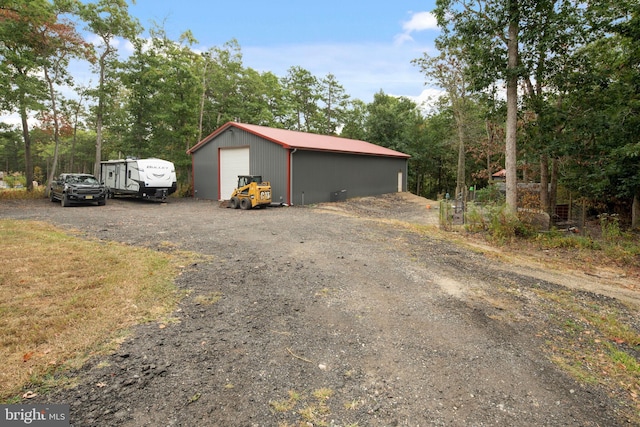 view of outbuilding featuring a garage