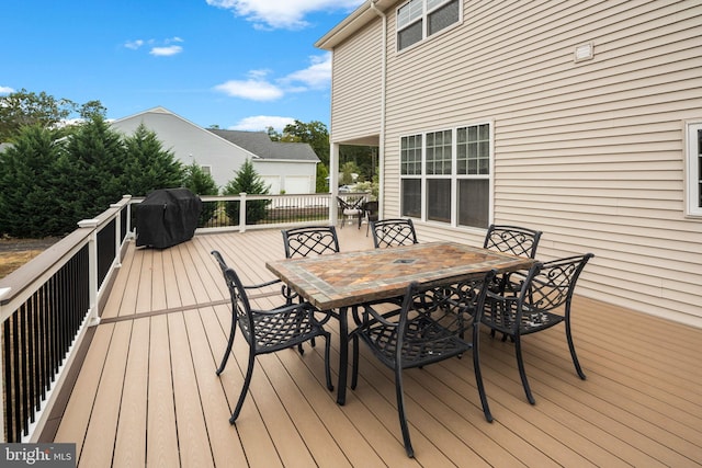 wooden deck featuring grilling area