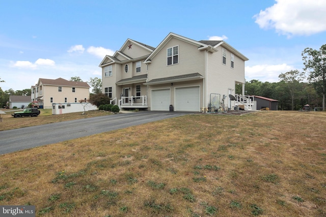 view of front of home with a garage and a front yard