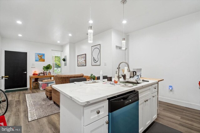 kitchen with white cabinets, an island with sink, sink, stainless steel dishwasher, and dark hardwood / wood-style floors