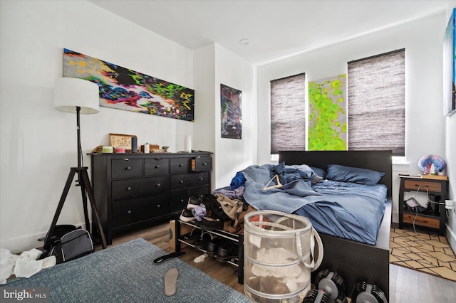 bedroom with hardwood / wood-style floors