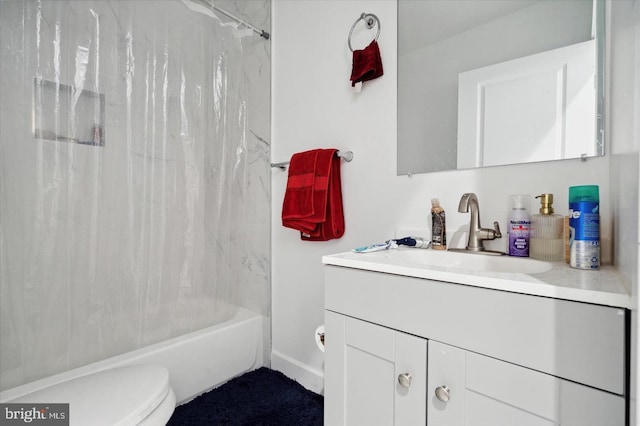 full bathroom featuring shower / bath combo, vanity, and toilet