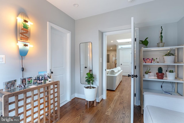 corridor featuring hardwood / wood-style flooring