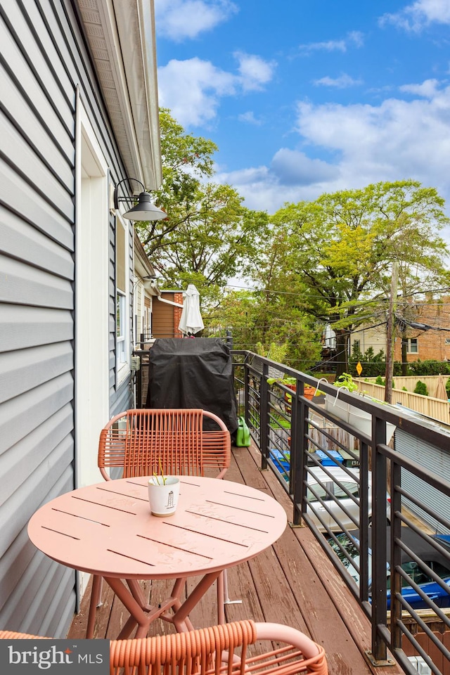 wooden deck featuring grilling area