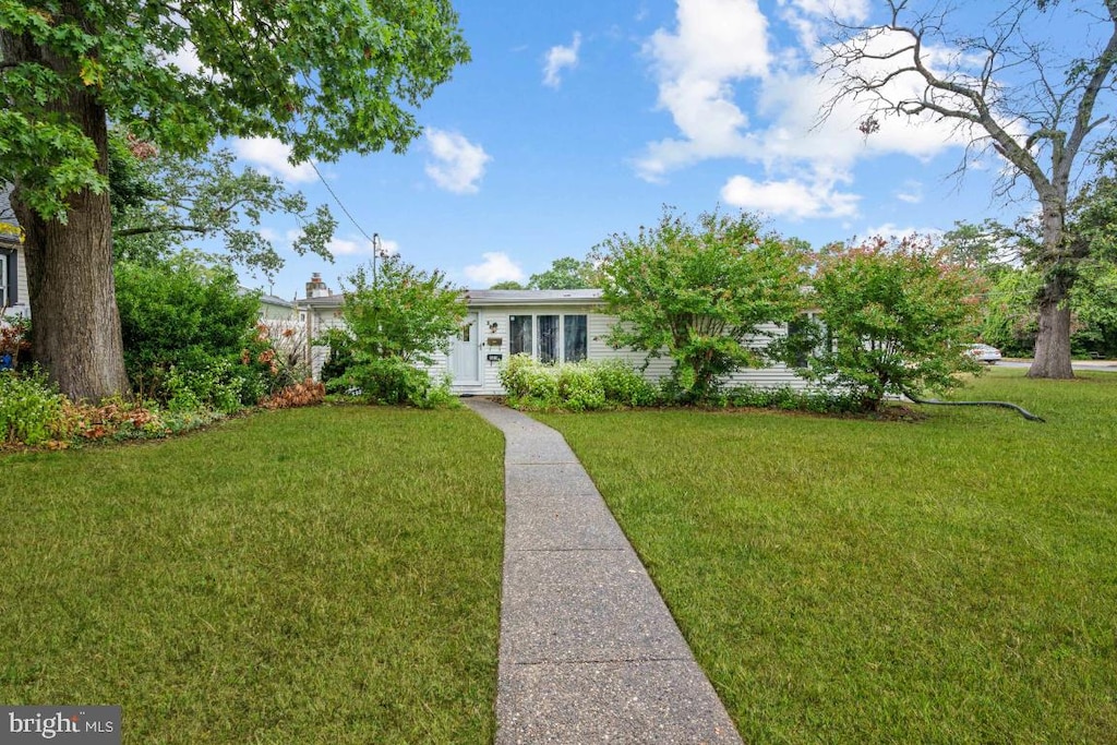 view of front of home with a front yard