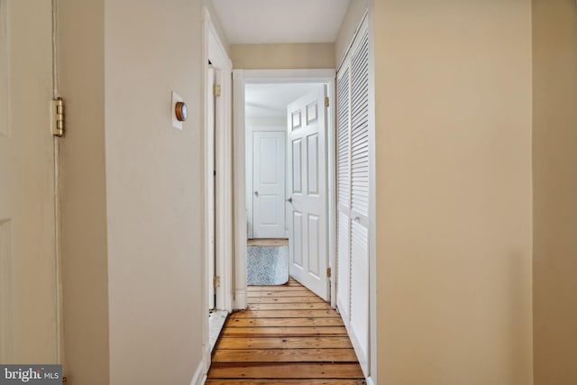 hallway with light wood-type flooring