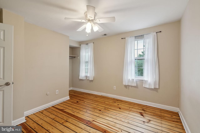 empty room featuring light hardwood / wood-style floors and ceiling fan