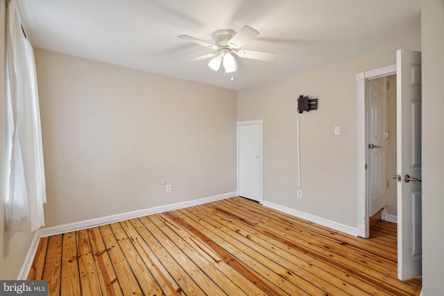 spare room with light hardwood / wood-style floors and ceiling fan