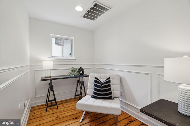 living area featuring hardwood / wood-style floors