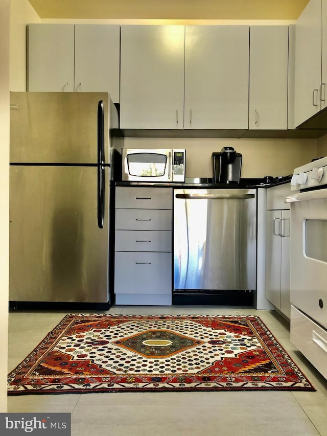 kitchen featuring appliances with stainless steel finishes and gray cabinetry