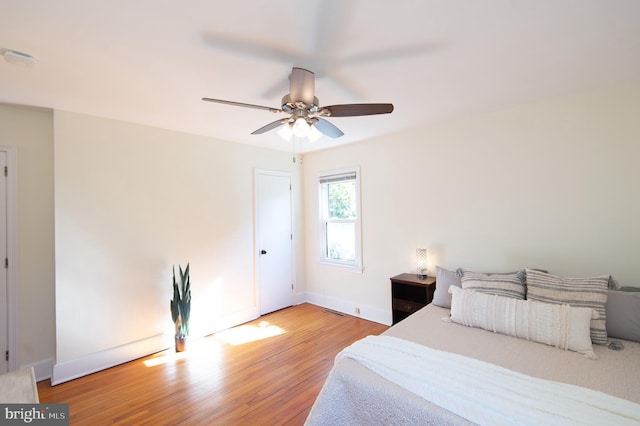 bedroom featuring ceiling fan and hardwood / wood-style flooring