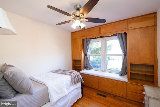 bedroom featuring light hardwood / wood-style floors and ceiling fan