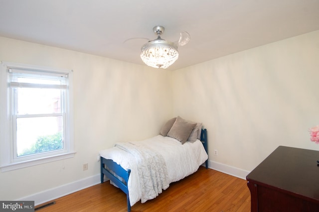 bedroom with hardwood / wood-style flooring