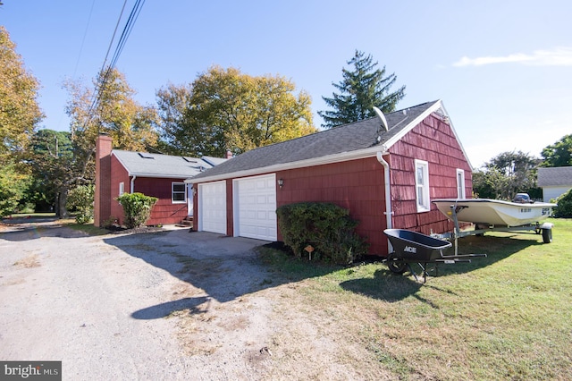 garage featuring a yard