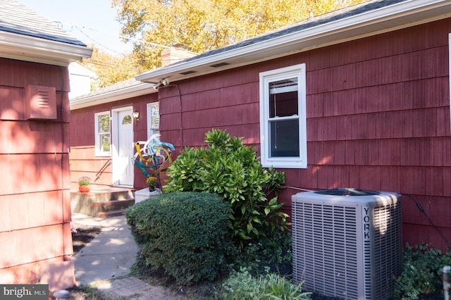 view of home's exterior with cooling unit