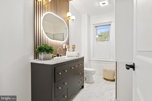 bathroom with vanity and toilet