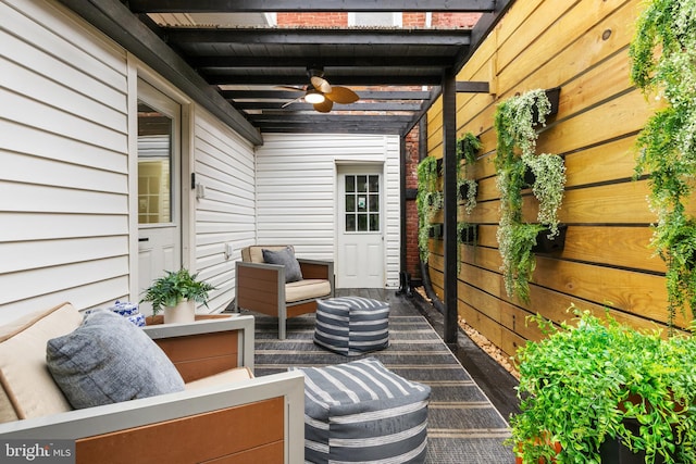 view of patio featuring an outdoor living space and ceiling fan