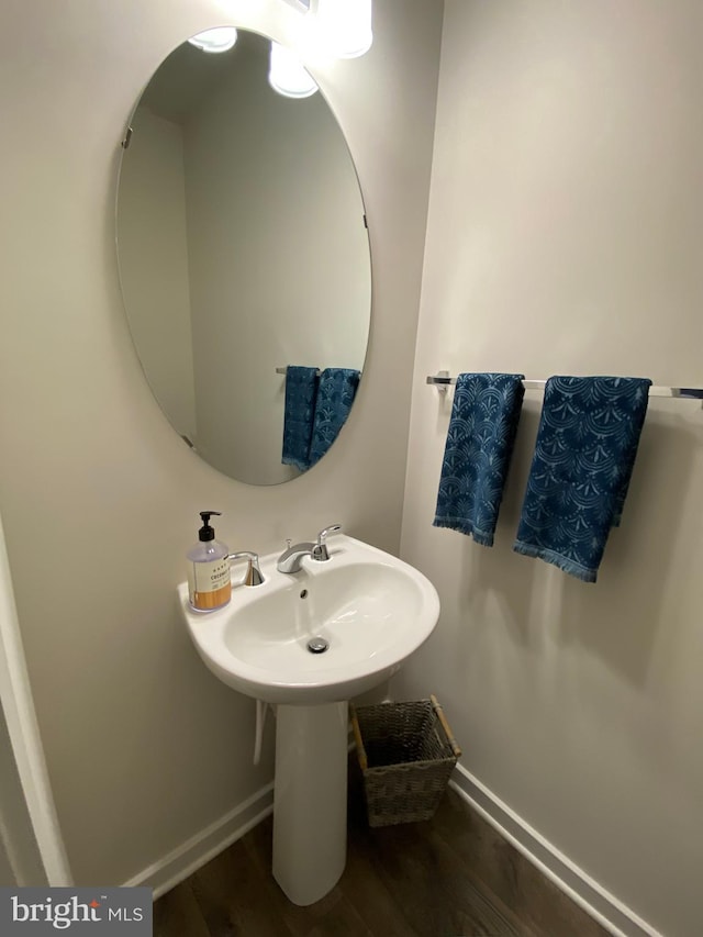 bathroom with hardwood / wood-style flooring