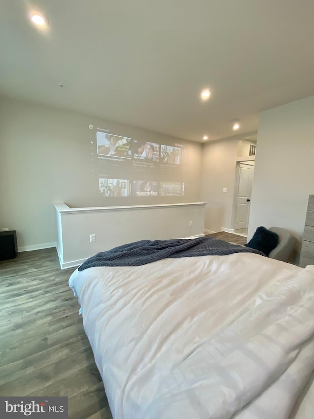 bedroom with hardwood / wood-style floors