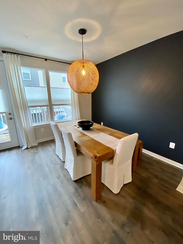 unfurnished dining area featuring dark hardwood / wood-style flooring and a wealth of natural light