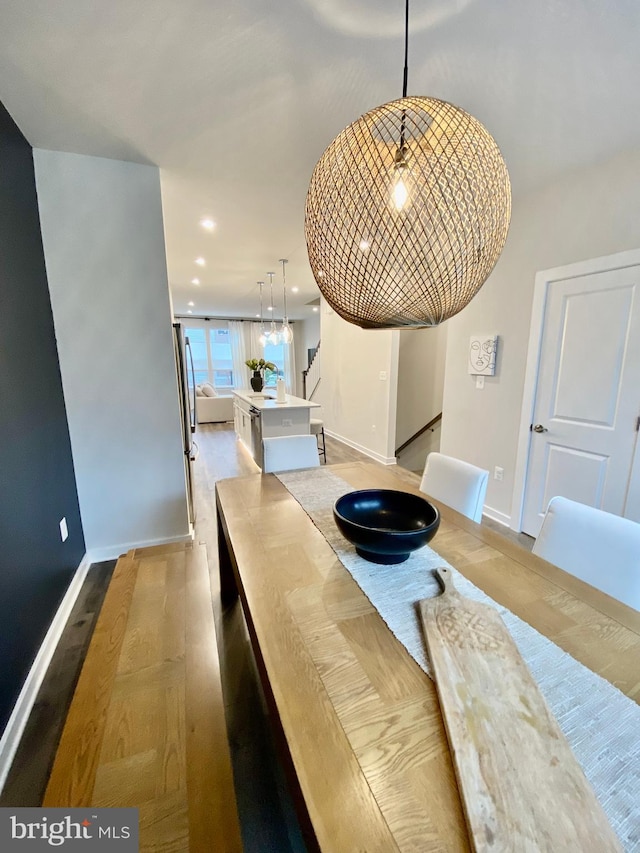 dining space featuring light hardwood / wood-style floors