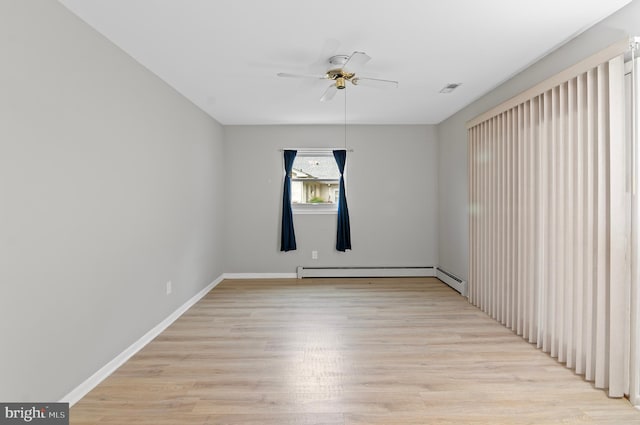 unfurnished room featuring light hardwood / wood-style floors, ceiling fan, and a baseboard radiator