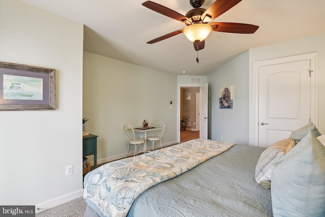 bedroom featuring ceiling fan and carpet