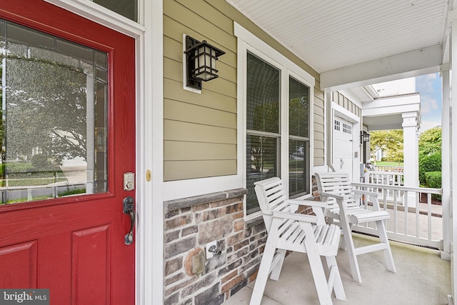 doorway to property with a porch