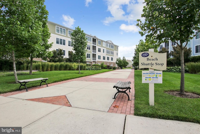 view of property's community featuring a yard