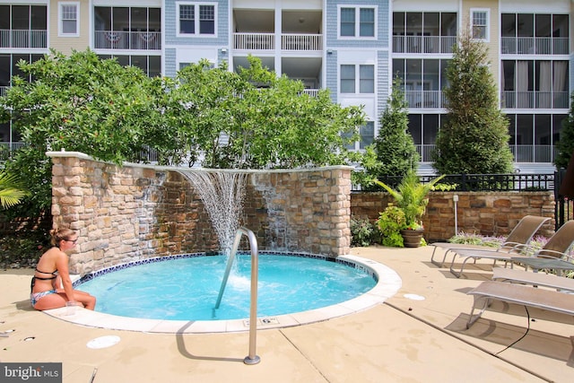 view of swimming pool featuring a patio