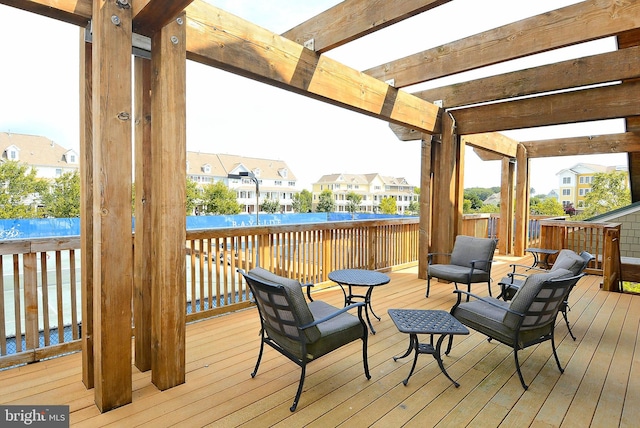 wooden deck featuring a pergola