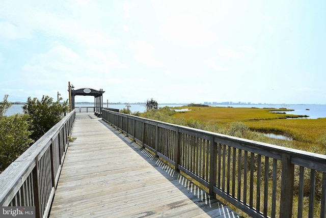 surrounding community featuring a water view