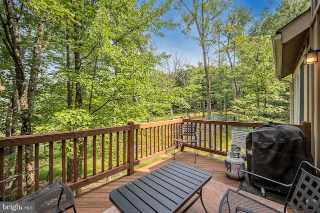 wooden terrace with area for grilling