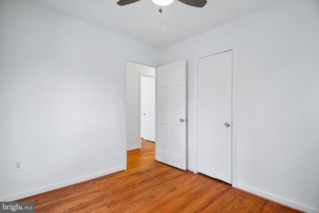 unfurnished bedroom featuring ceiling fan and light wood-type flooring