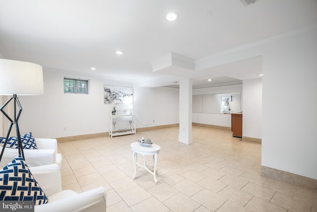 basement featuring light tile patterned flooring and ornamental molding