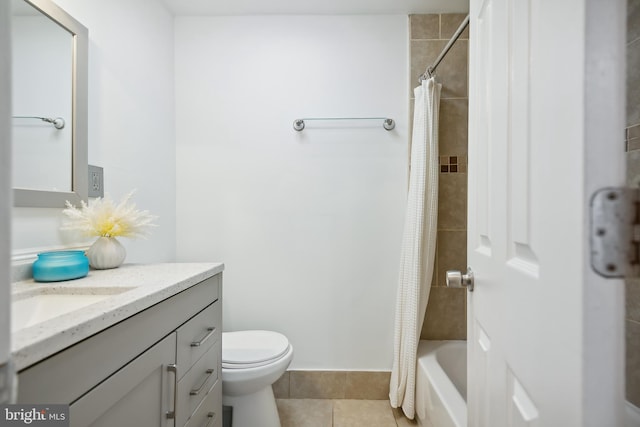 full bathroom with vanity, tile patterned flooring, toilet, and shower / tub combo