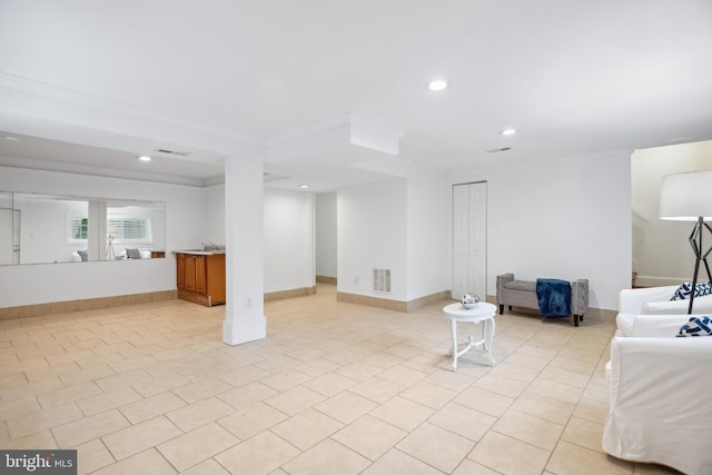 unfurnished living room with light tile patterned flooring