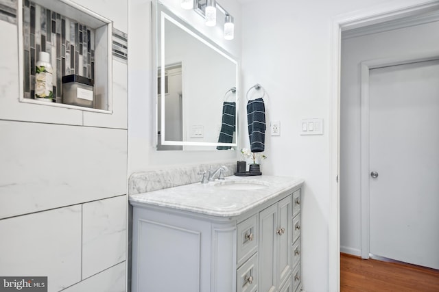 bathroom featuring hardwood / wood-style flooring and vanity