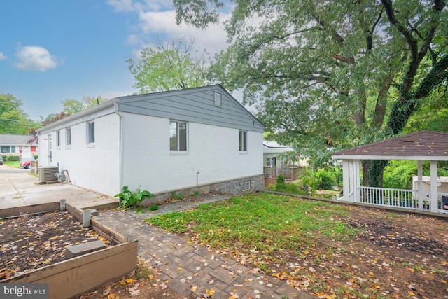 view of property exterior featuring a patio and central air condition unit