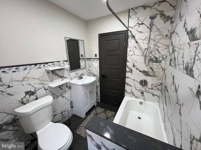 full bathroom featuring tile walls, shower / bath combination, vanity, and toilet