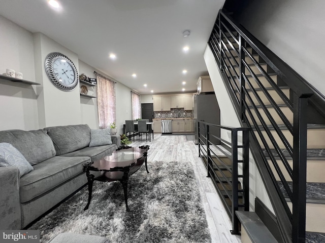 living room with light hardwood / wood-style flooring