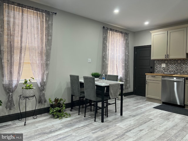 dining space featuring light hardwood / wood-style flooring and a wealth of natural light