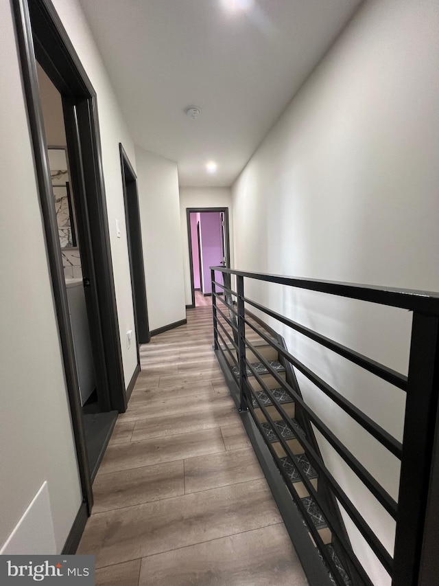 corridor featuring light hardwood / wood-style flooring