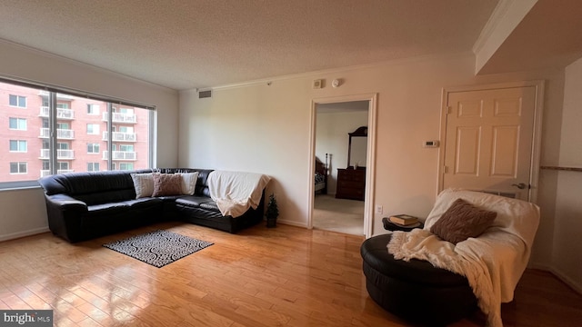 3101 N Hampton Dr Unit 814, Alexandria, VA 22302 - living area with crown molding, visible vents, and wood finished floors