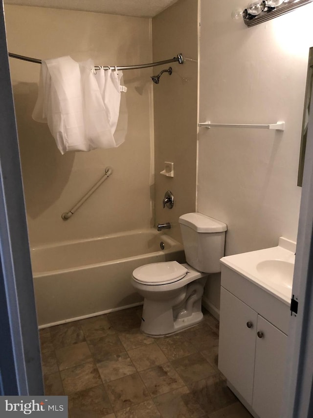 full bathroom featuring shower / bath combination with curtain, vanity, and toilet