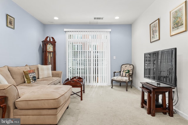 sitting room with light colored carpet