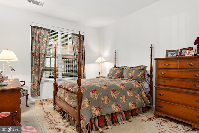 bedroom with light colored carpet